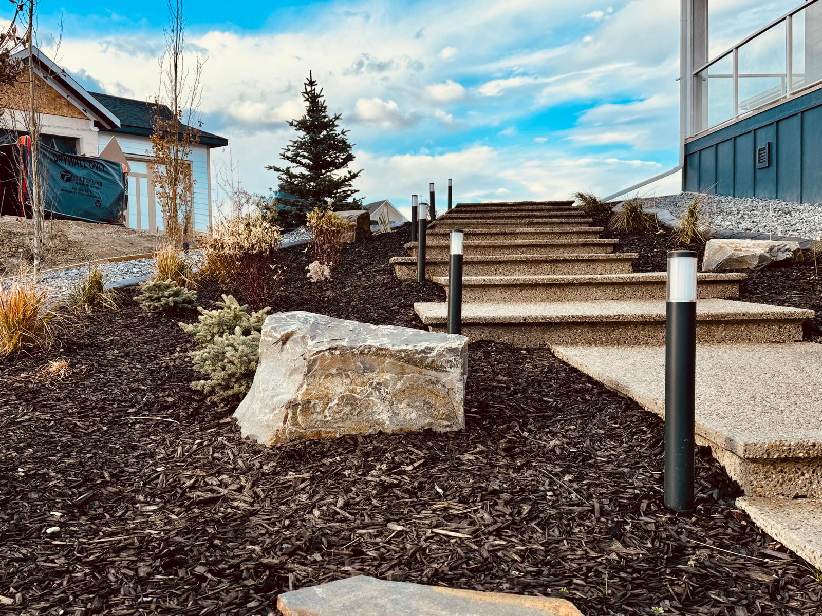 Landscaped stone steps with modern outdoor lighting
