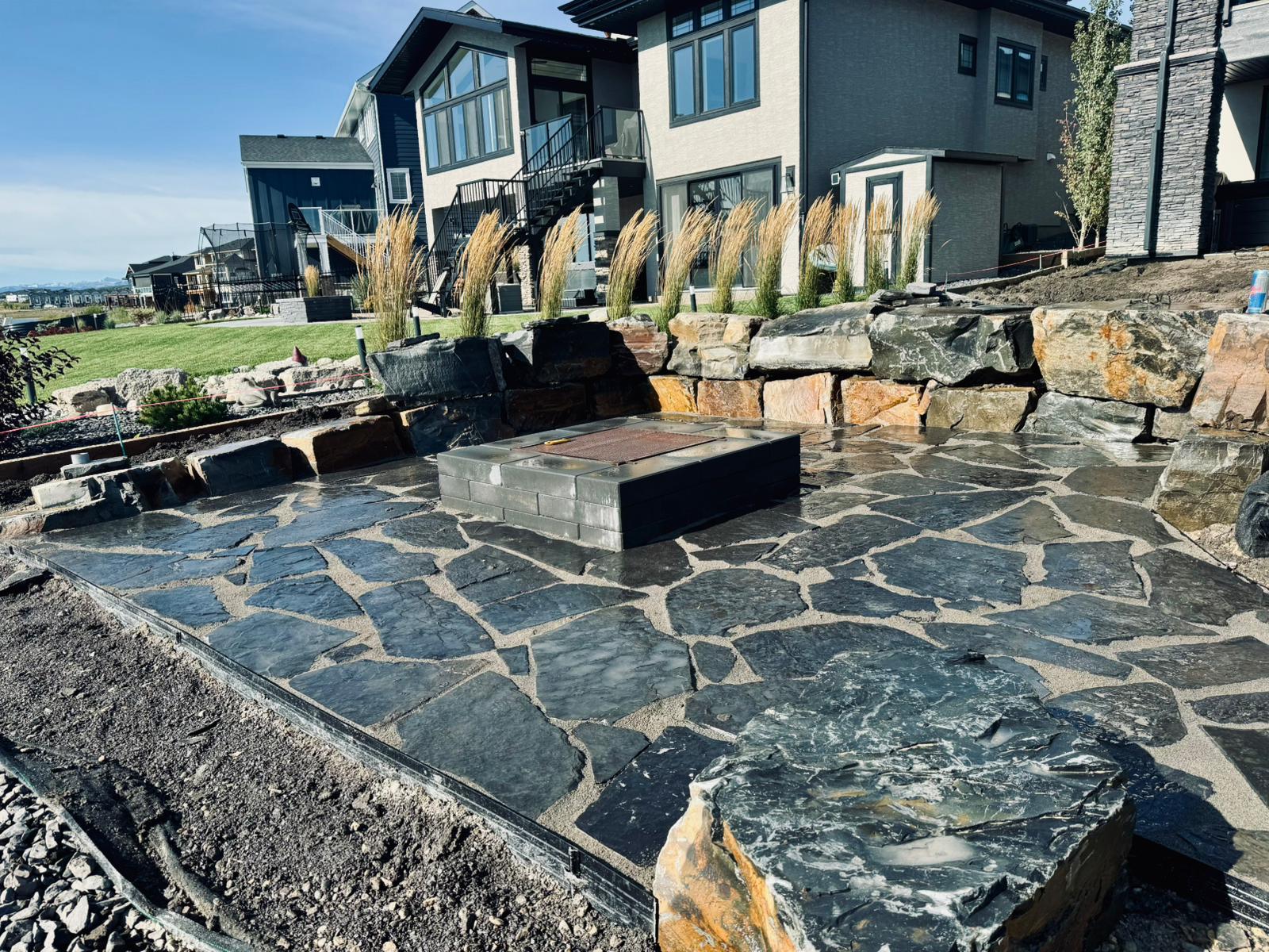 Modern flagstone patio with built-in fire pit