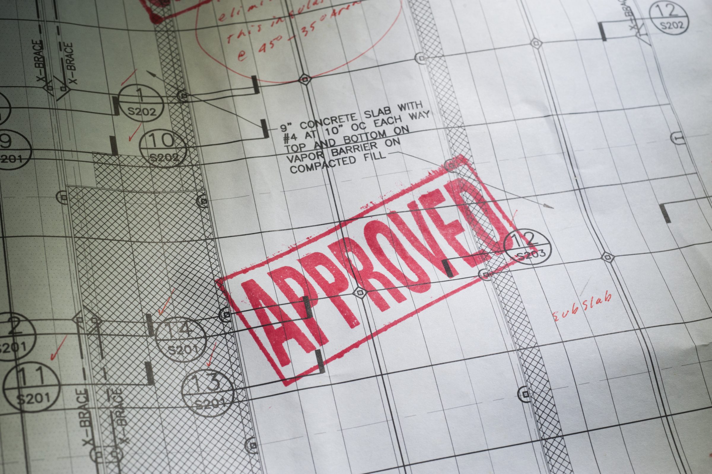 Architectural blueprint with red APPROVED stamp