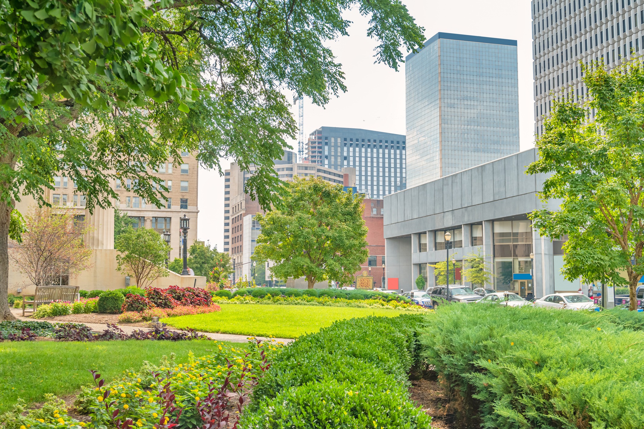 Urban park with gardens and downtown skyscrapers