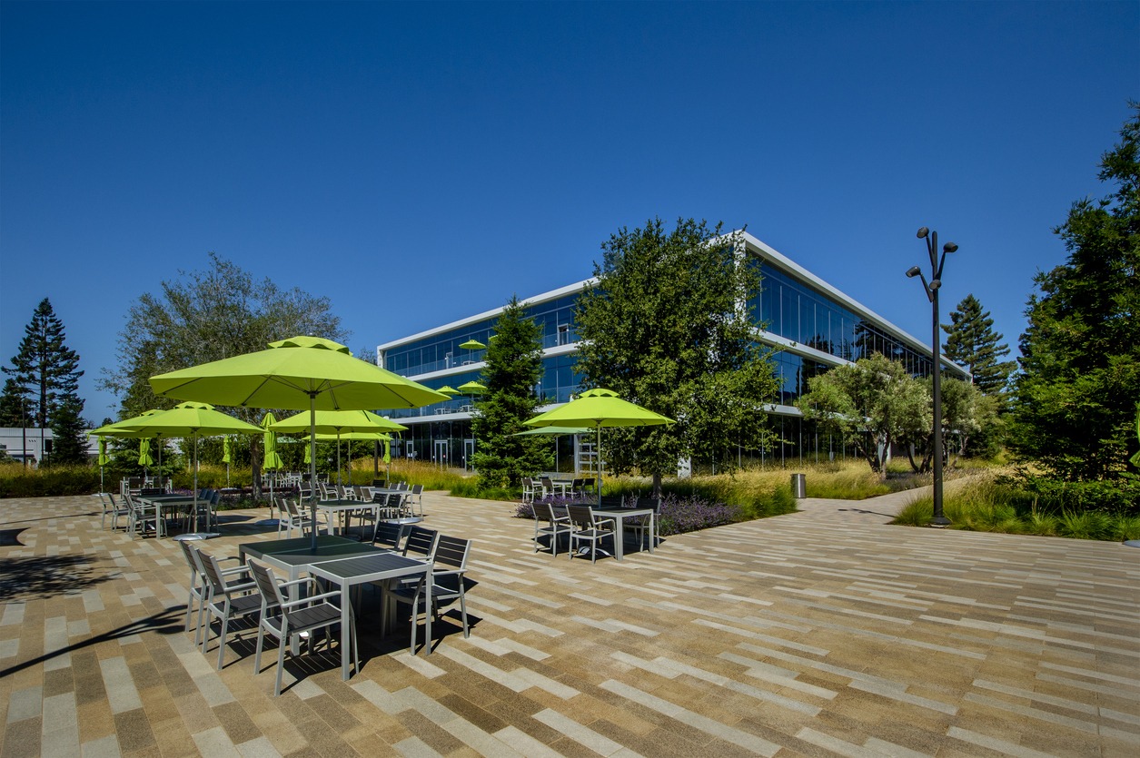 Modern office building with outdoor patio seating