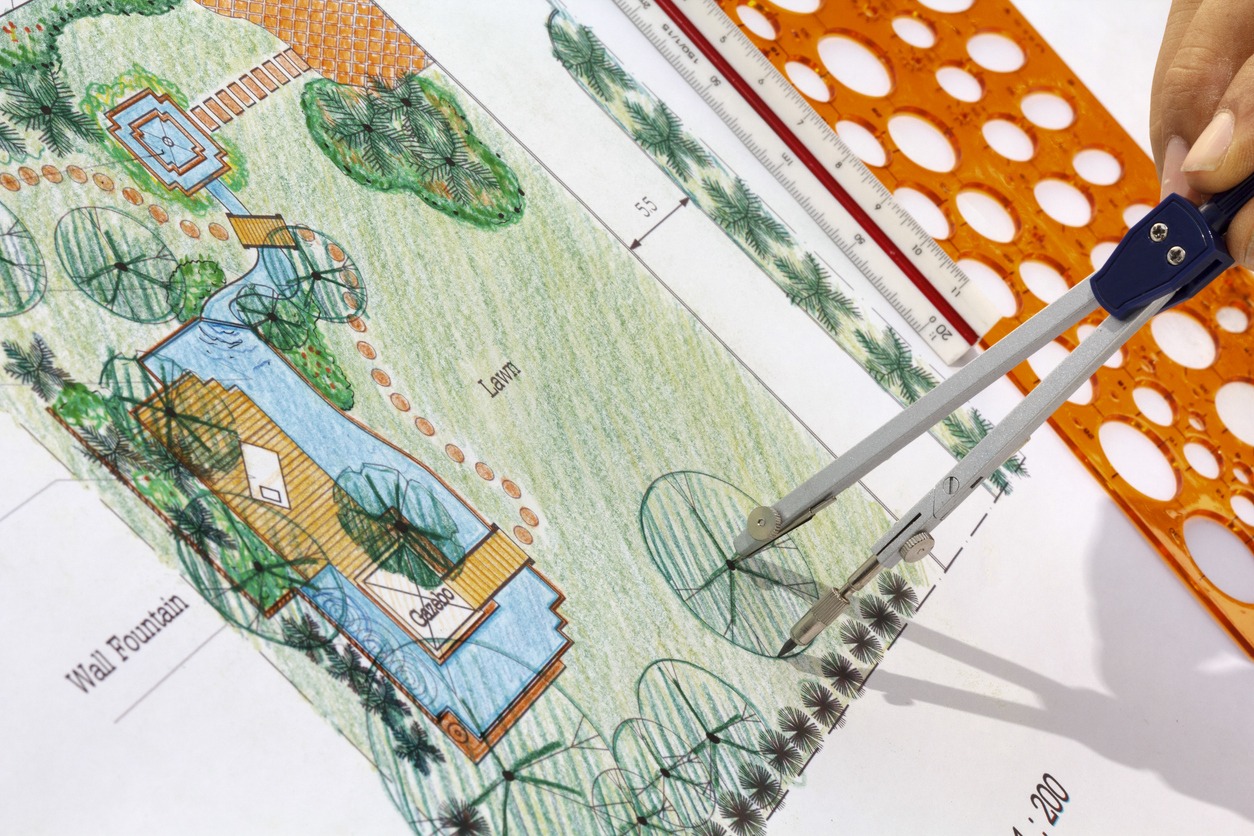 Landscape design plan with compass and drafting tools